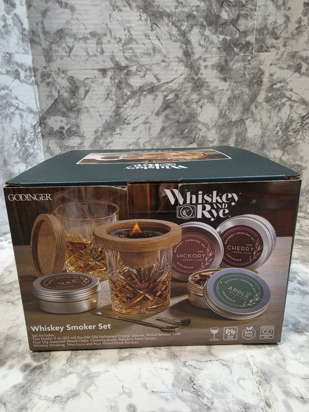 Whiskey and Rye smoker kit packaging on a marble surface