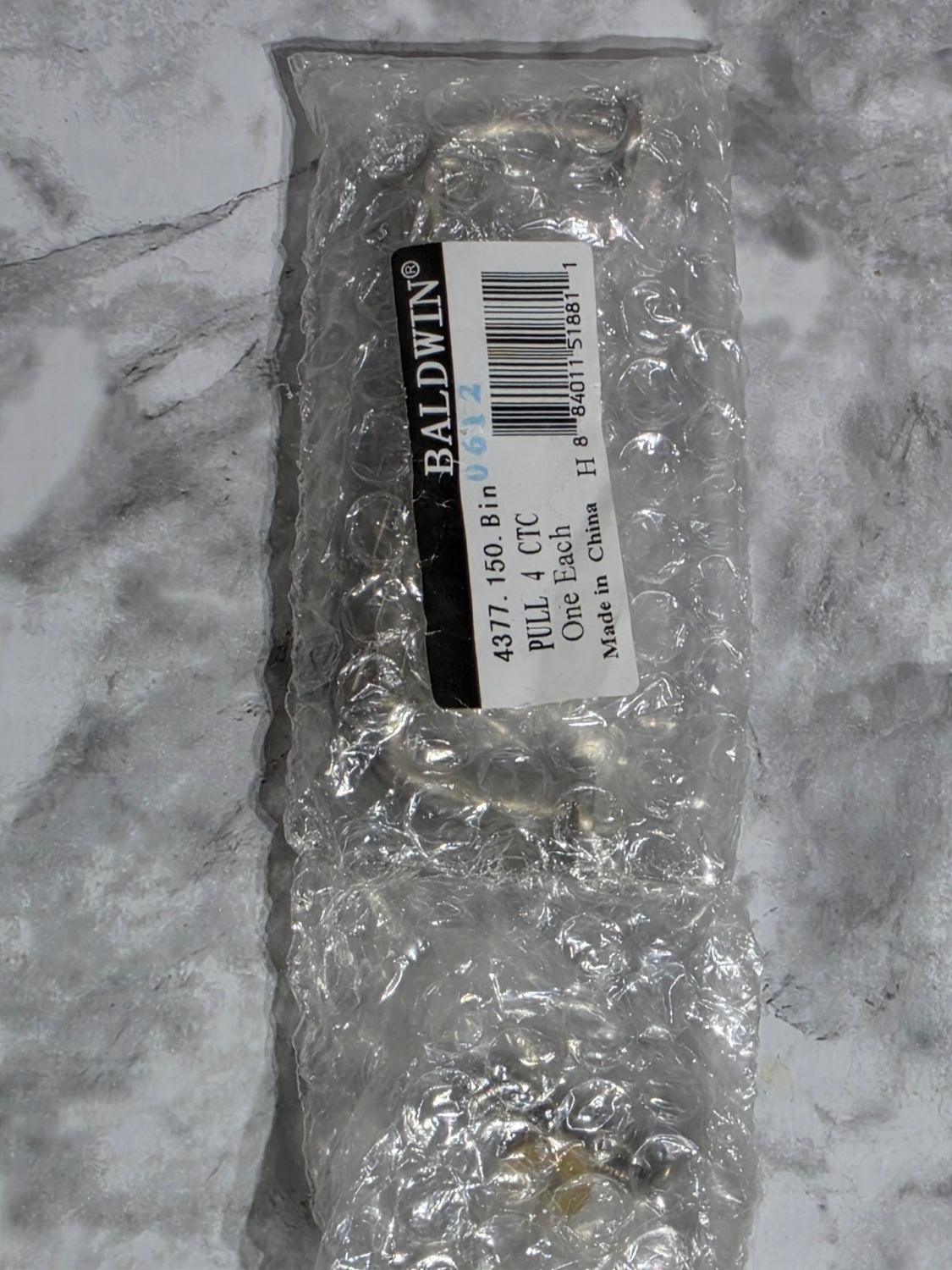 Packaged item with a label on a marble surface
