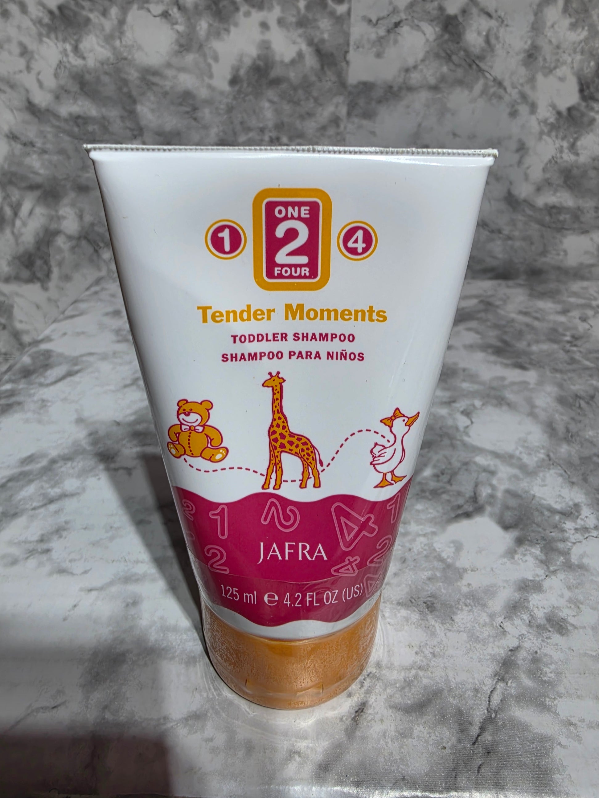 Jafra baby shampoo bottle on a marble surface