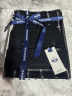 Box of Dockers socks with a blue ribbon on a marble surface