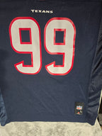 Navy blue sports jersey with red and white number 69 and 'Texans' text on a gray surface.