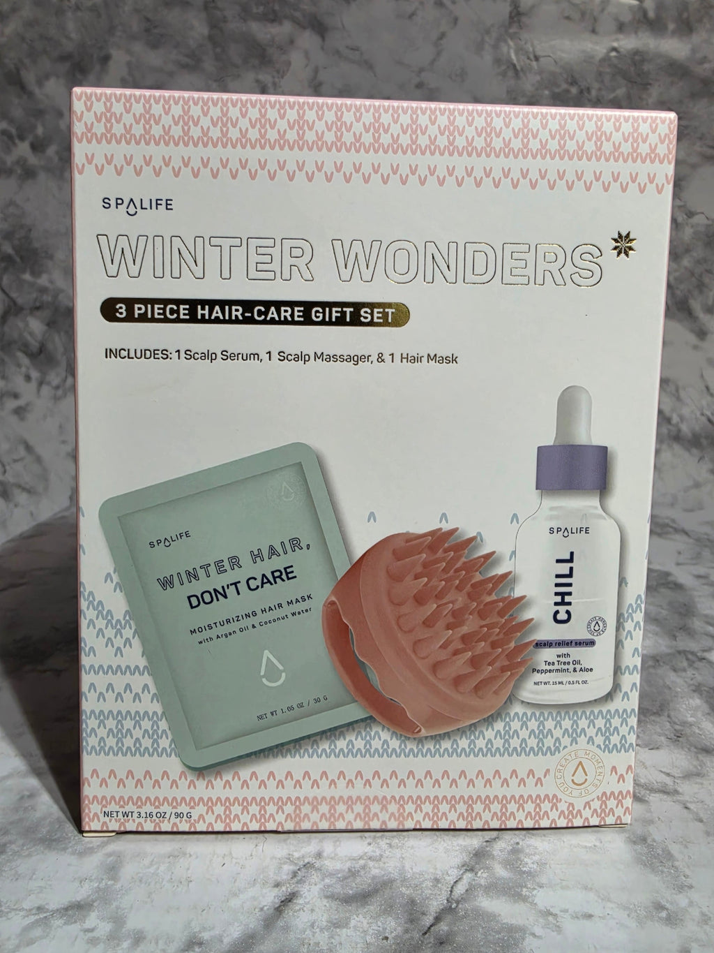 Spaife Winter Wonders 3-piece hair care gift set packaging on a marble surface