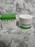 Rodan + Fields Soothe Rescue Mask jar and box on a marble surface
