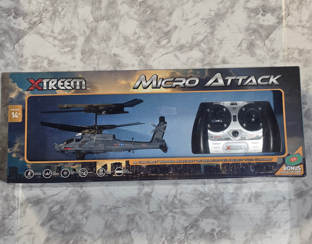 Boxed Xtreem Micro Attack RC helicopter set on a marble surface
