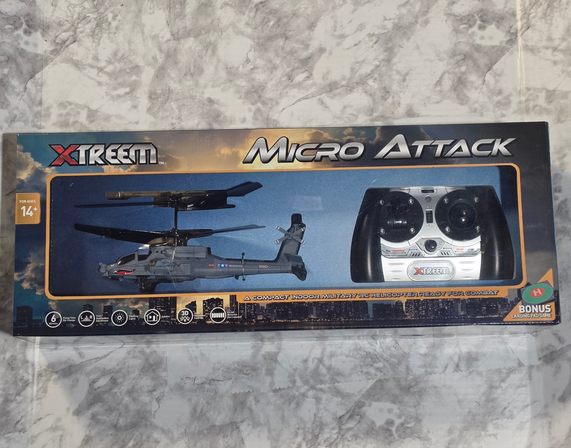 Boxed Xtreem Micro Attack RC helicopter set on a marble surface