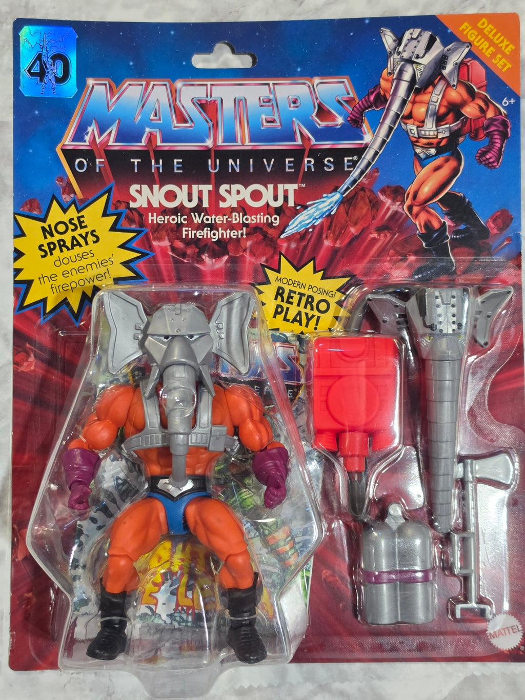 Vintage toy figure in packaging with 'Master of the Universe' branding