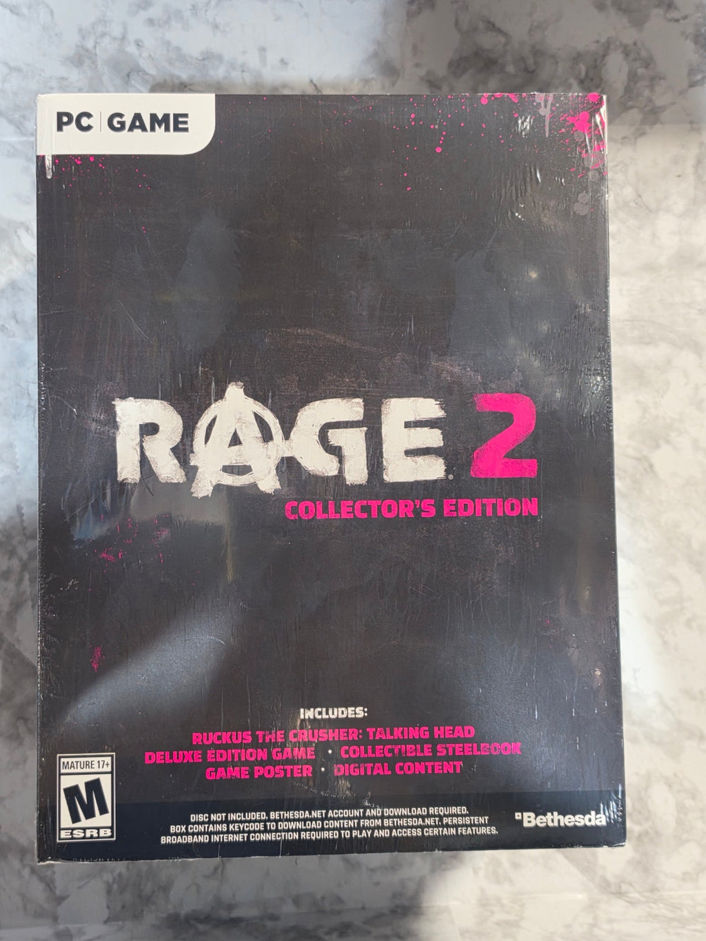 Rage 2 Collector's Edition game box on a textured surface