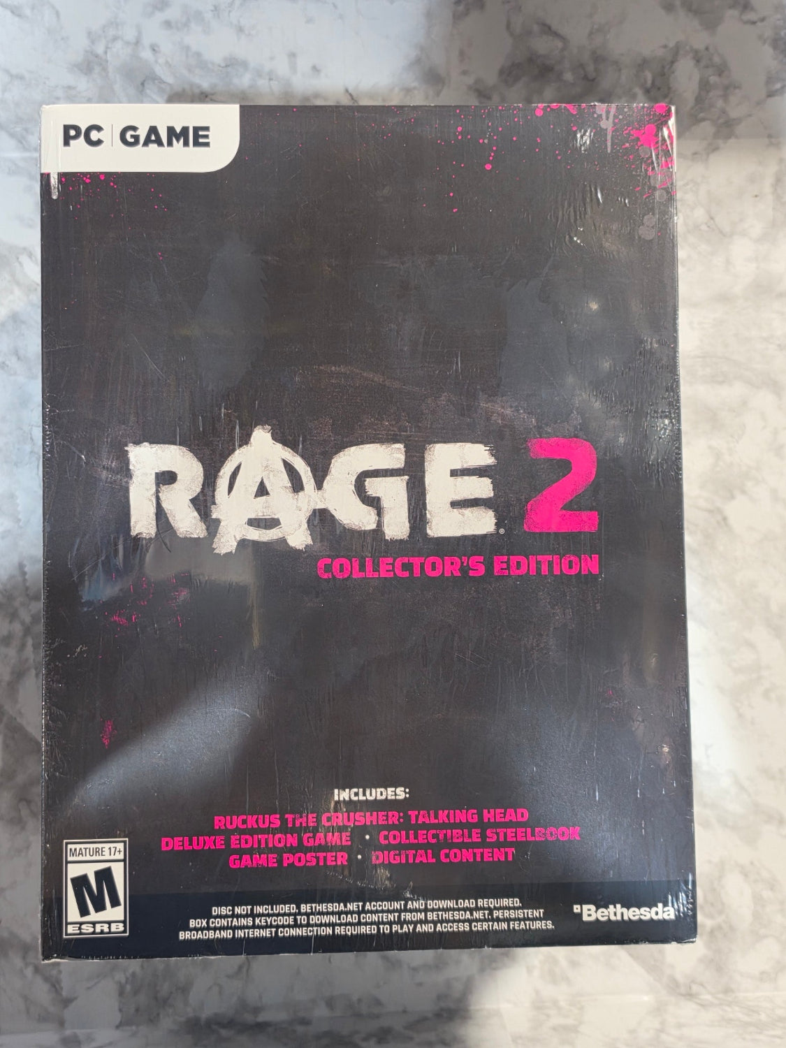 Rage 2 Collector's Edition game box on a textured surface