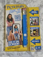Pictionaryalk 2 game packaging with a blue marker on a gray surface