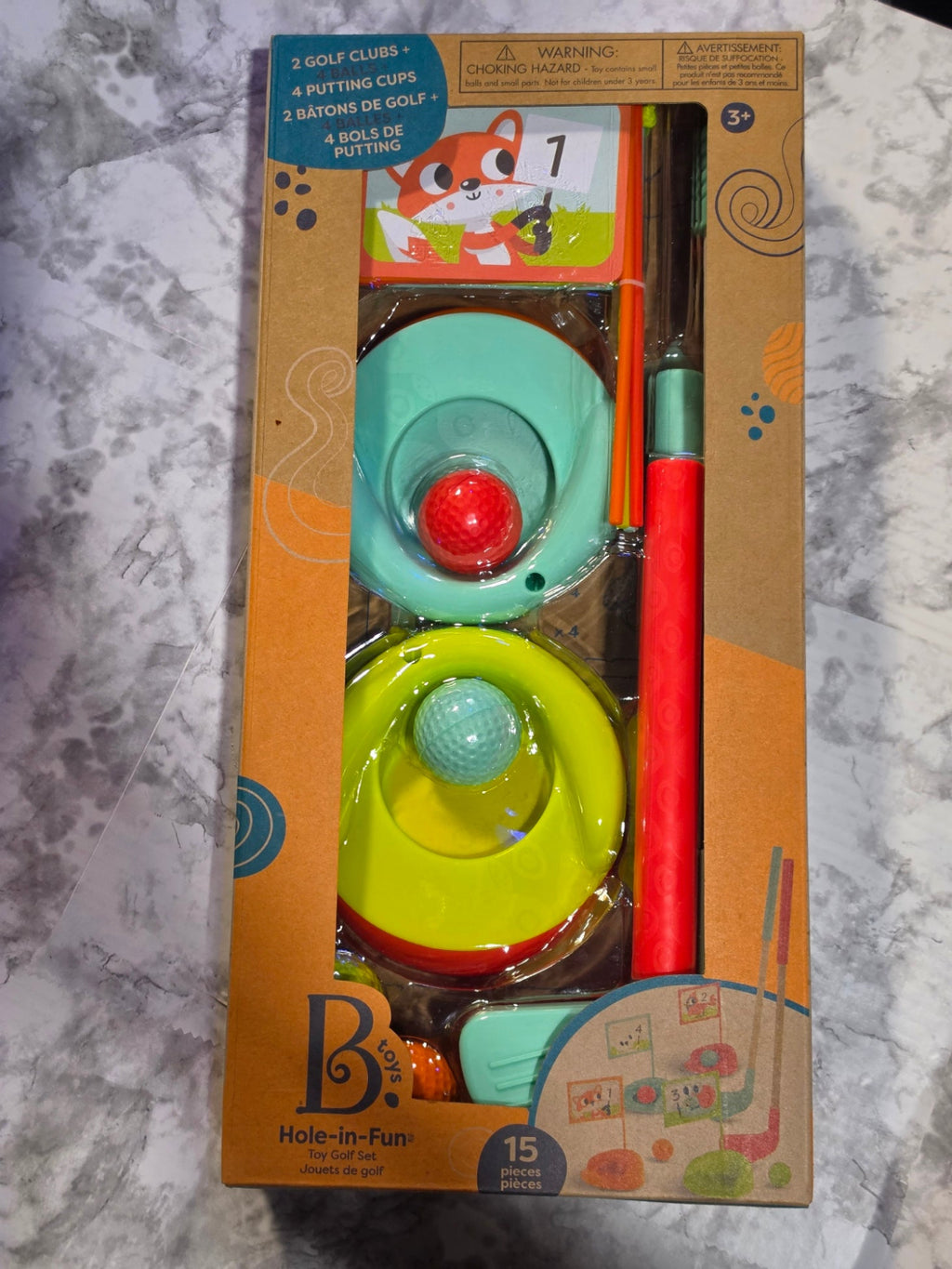 B. toys packaging with colorful toys on a marble surface