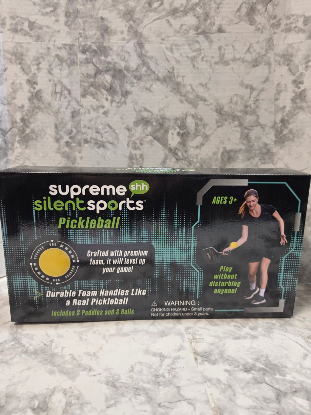 Supreme Silent Sports pickleball packaging on a marble surface