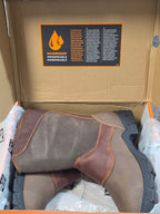 Brown boot with visible brand label on a cardboard box