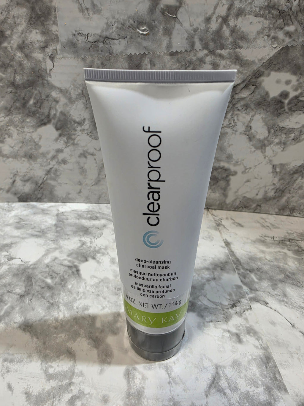 Tube of clearproof skincare product on a marble surface