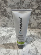 Tube of clearproof skincare product on a marble surface