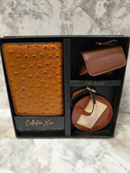 Collection XIIX brown three-piece travel set in its gift box