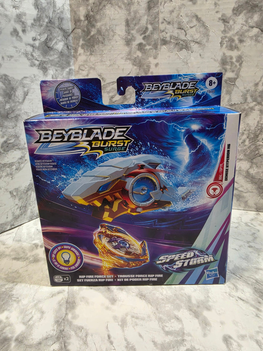 Beyblade Burst toy box on a marble surface