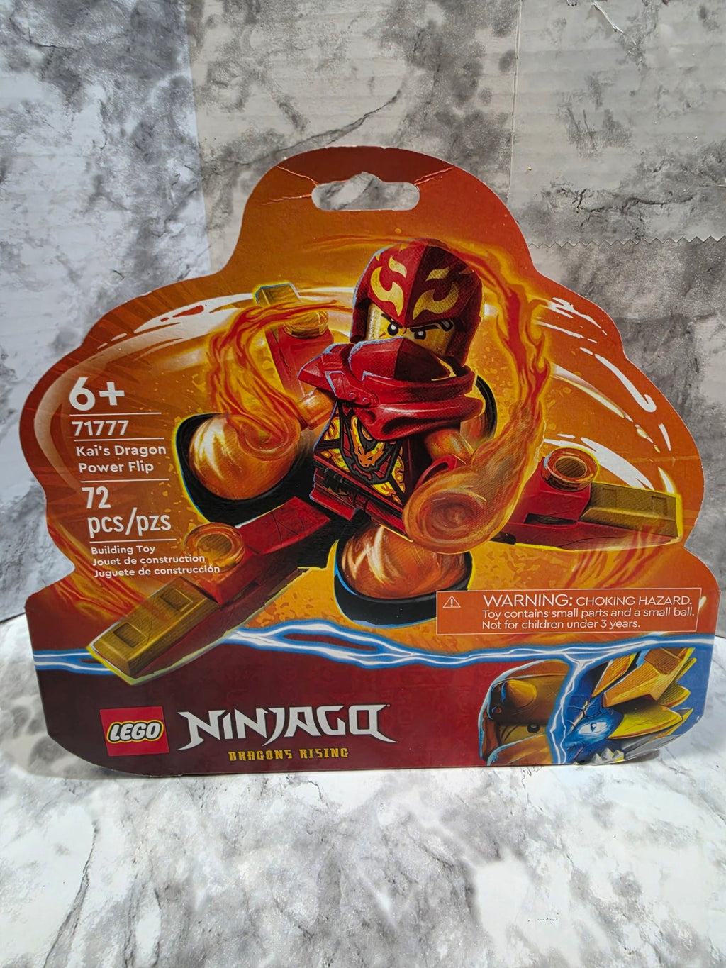 LEGO Ninjago toy package on a marble surface