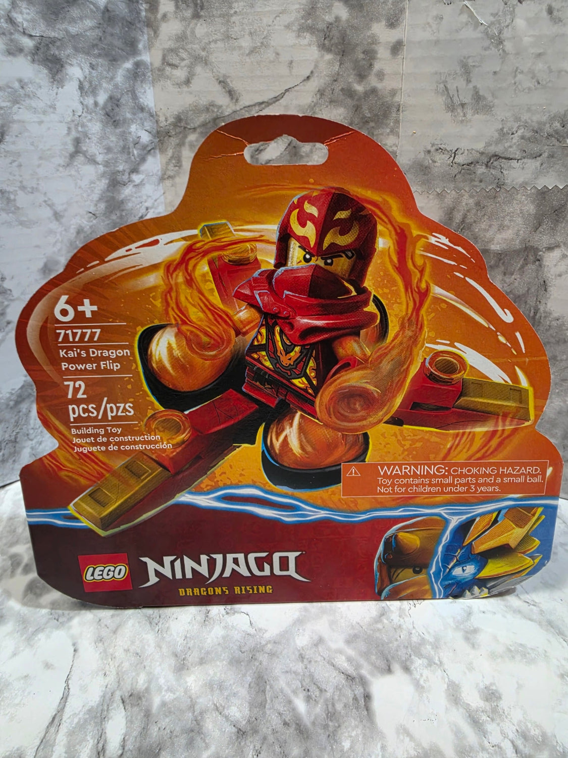 LEGO Ninjago toy package on a marble surface