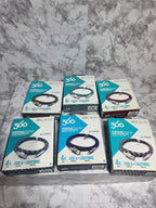 Multiple boxes of 360° Technology headlamps on a gray concrete surface