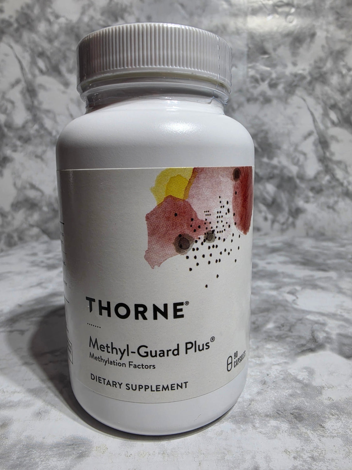 Thorne Methyl-Guard Plus supplement bottle on a marble surface