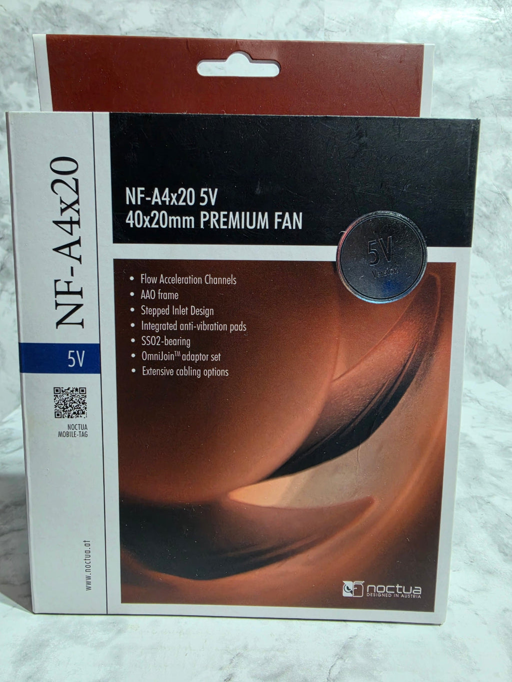 Product packaging with a fan on a white background