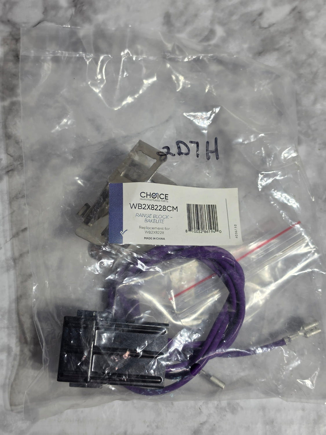 Electrical components in clear packaging on a marble surface