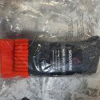 Wolverine wool boot socks with packaging on a gray surface