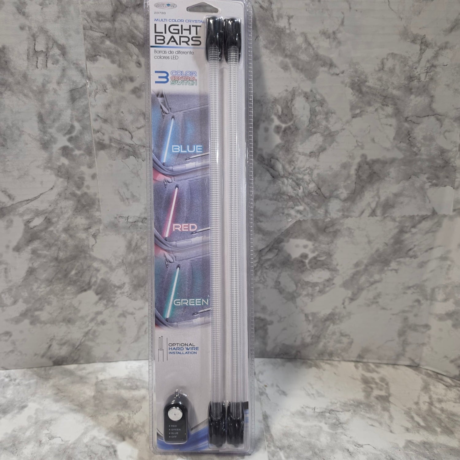 Packaged light bars with blue, red, and green options on a marble surface