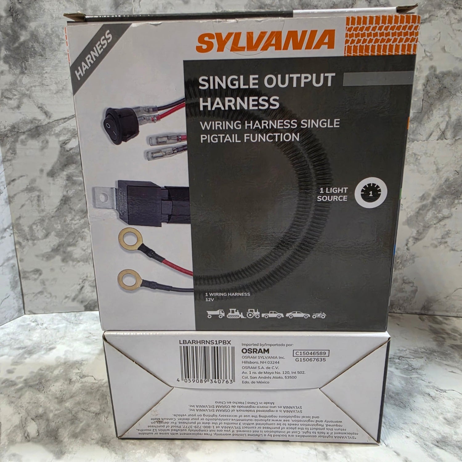 Sylvania harness packaging on a marble surface