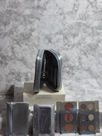 Makeup palette with various shades on a marble surface