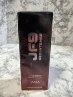 Jafra Red Intense perfume bottle on a marble surface