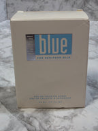 Je Ne Laisse Blue perfume box on a marble surface