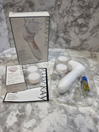 Mary Kay facial cleansing brush set with packaging on a marble surface