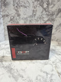 Black box with a rotary watch design on a marble surface