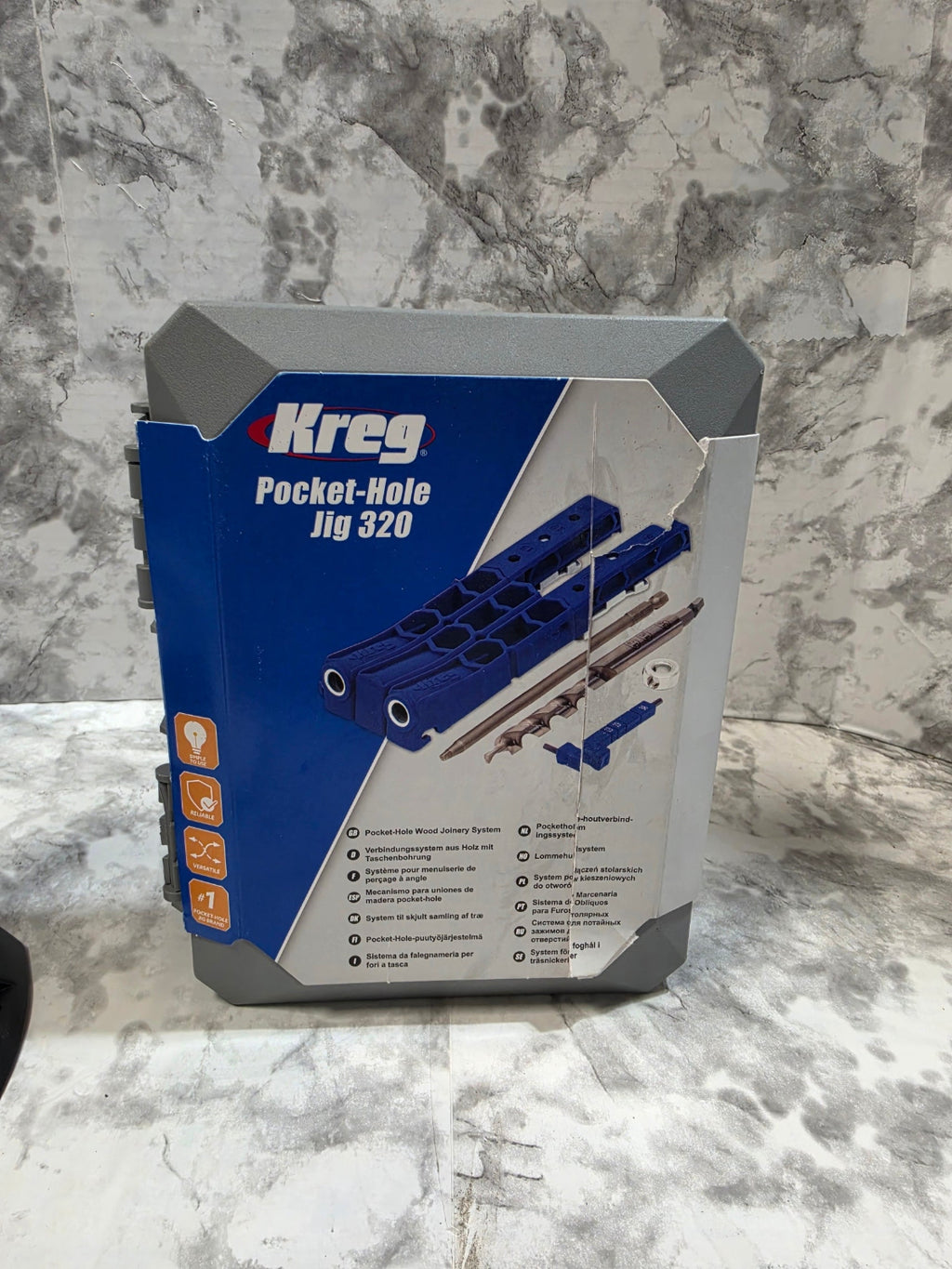 Kreg pocket-hole jig packaging on a marble surface