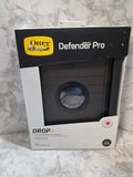 Box of OtterBox Defender Pro phone case on a marble surface