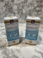 Two boxes of Nordic Naturals Omega-3 Pet on a marble surface