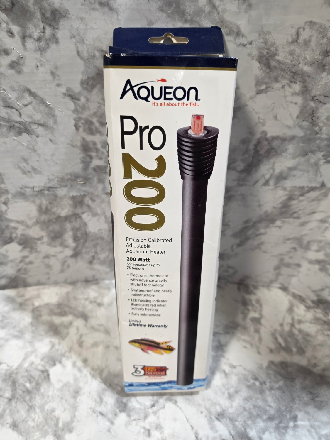 Aqueon Pro 200 heating element packaging on a marble surface
