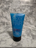 Blue hair product tube labeled 'SEXY HAIR STYLE' on a marble surface