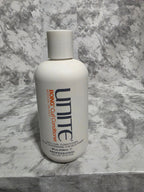 Unite Boing Curl Conditioner bottle on a marble surface