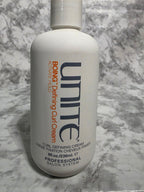 Unite Boing Defining Curl Cream bottle on a marble surface
