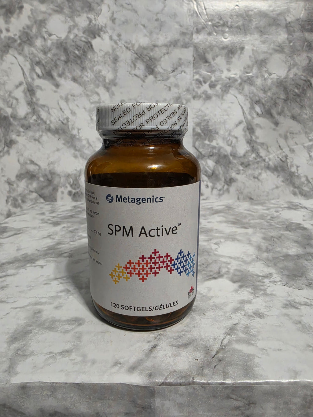 Bottle of SPME Active supplement on a marble surface