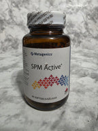 Actual stocked product photo of Metagenics SPM Active 60 softgels sealed bottle, front label.