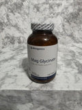 Bottle of Metagenics Mag Glycinate on a marble surface