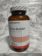 Metagenics Bone Builder supplement bottle on a marble surface
