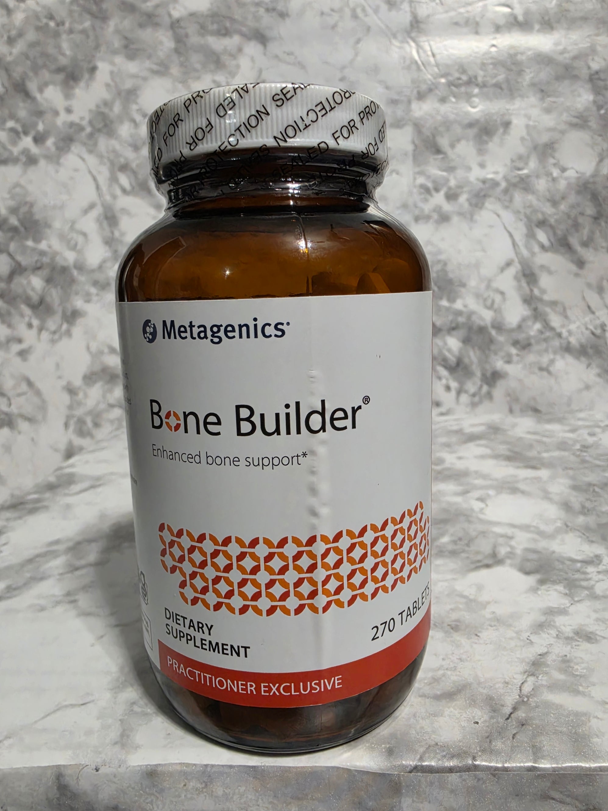 Metagenics Bone Builder supplement bottle on a marble surface