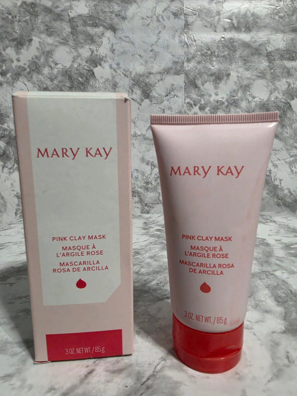 Mary Kay Pink Clay Mask packaging on a marble surface