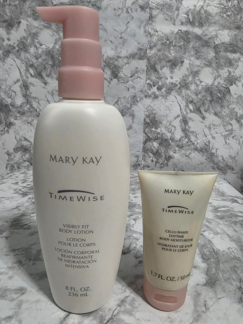 Two skincare products from Mary Kay on a marble surface