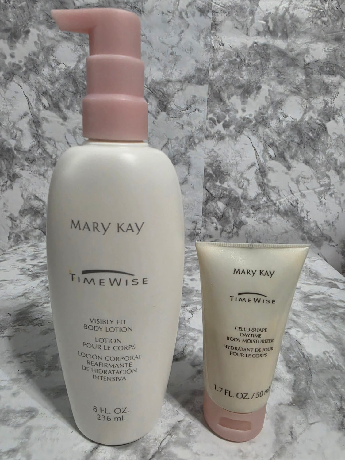 Two skincare products from Mary Kay on a marble surface