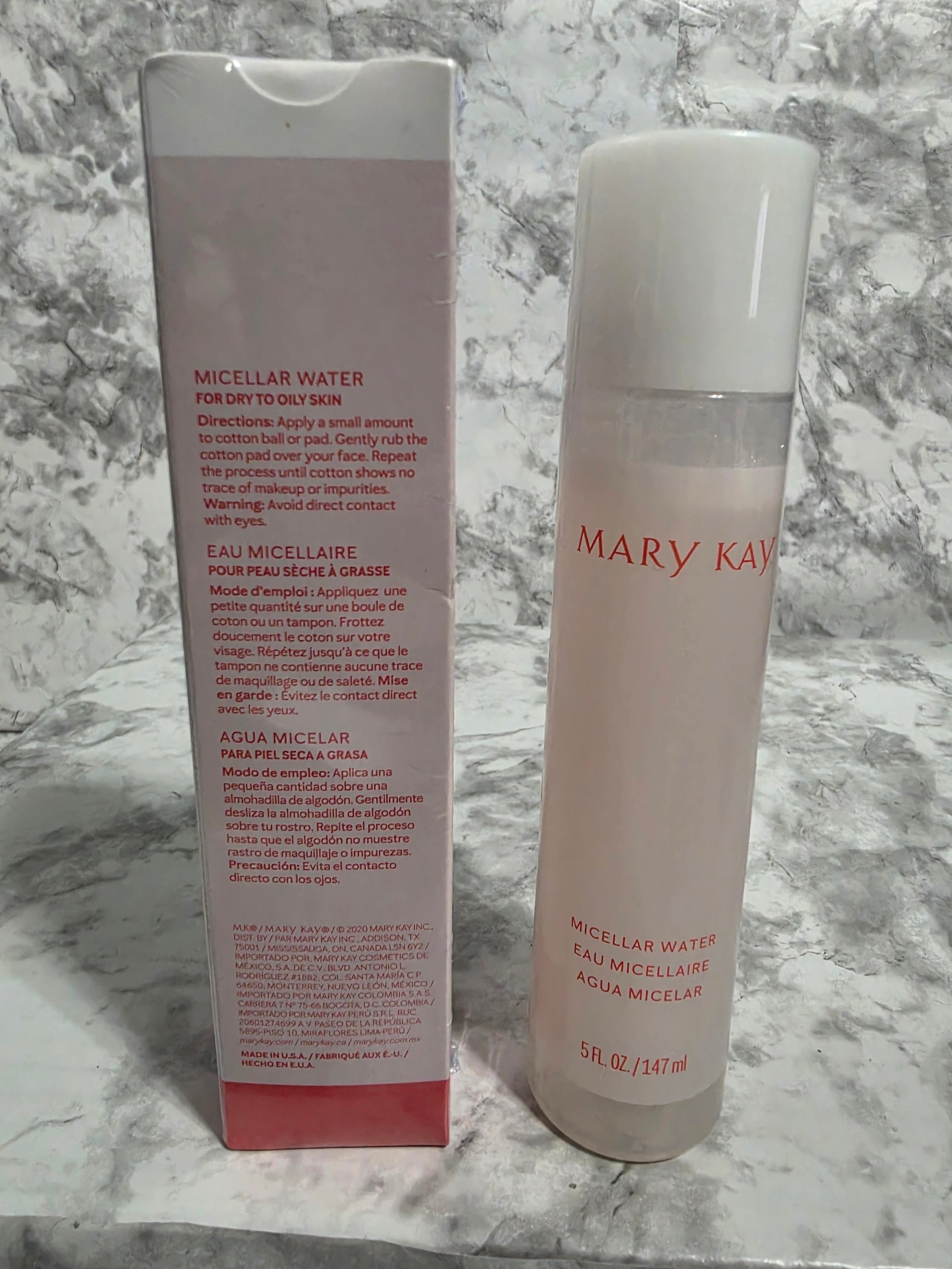 Two Mary Kay skincare products on a marble surface